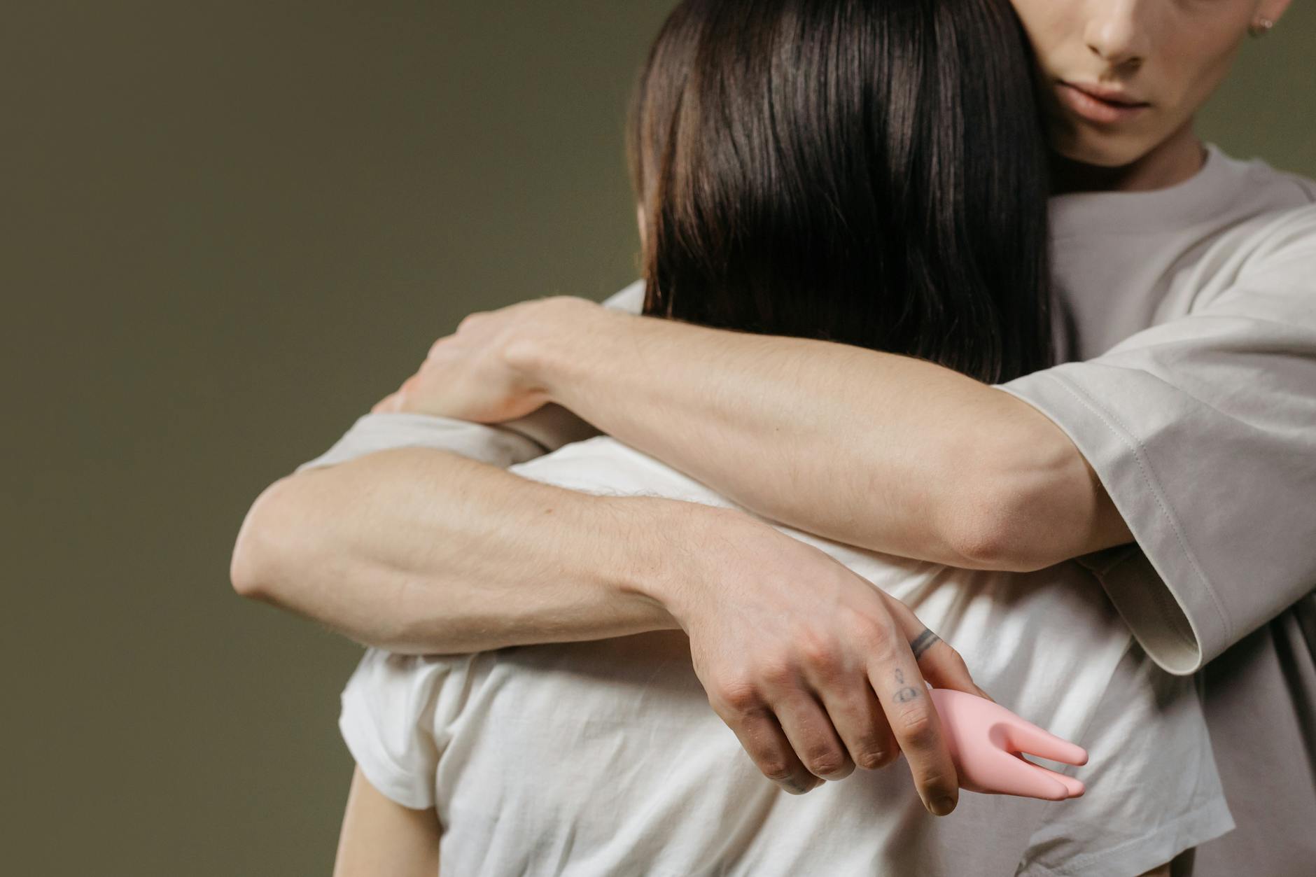 A couple embracing closely, highlighting intimate physical connection and emotional intimacy.